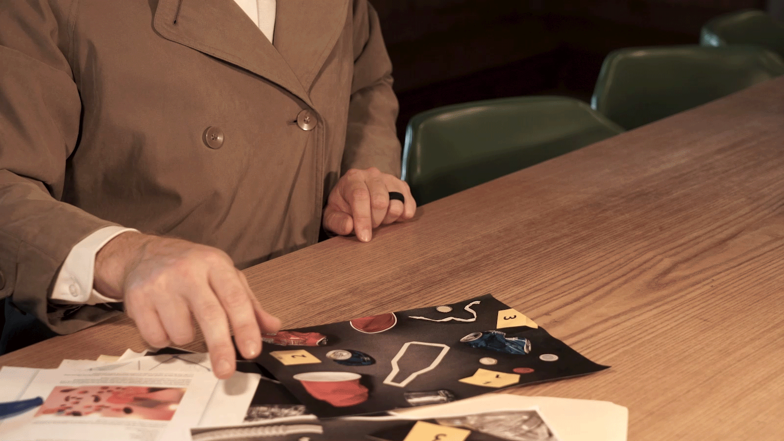 Detective waves away whiskey glass