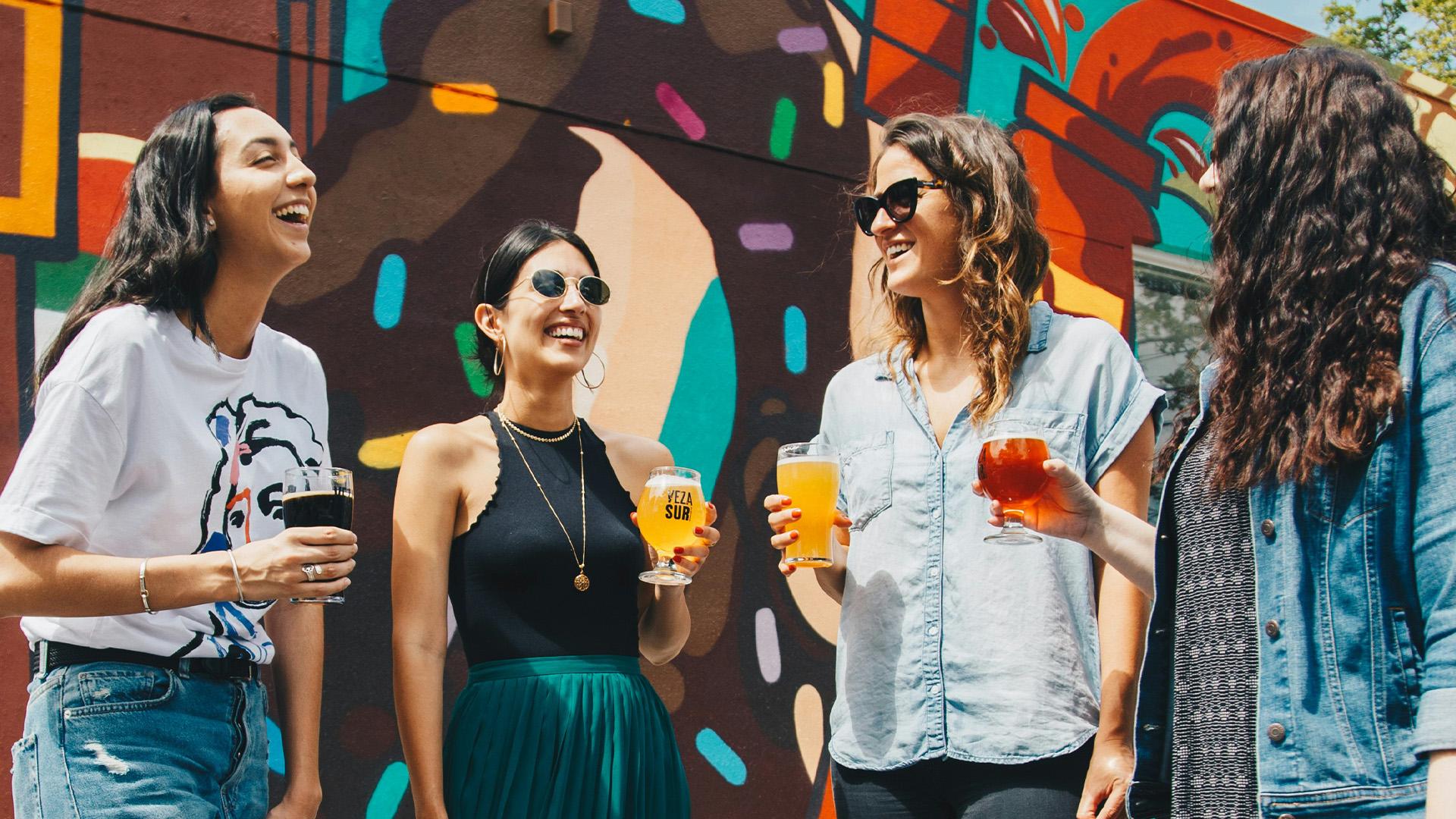4 women drinking at a brewery