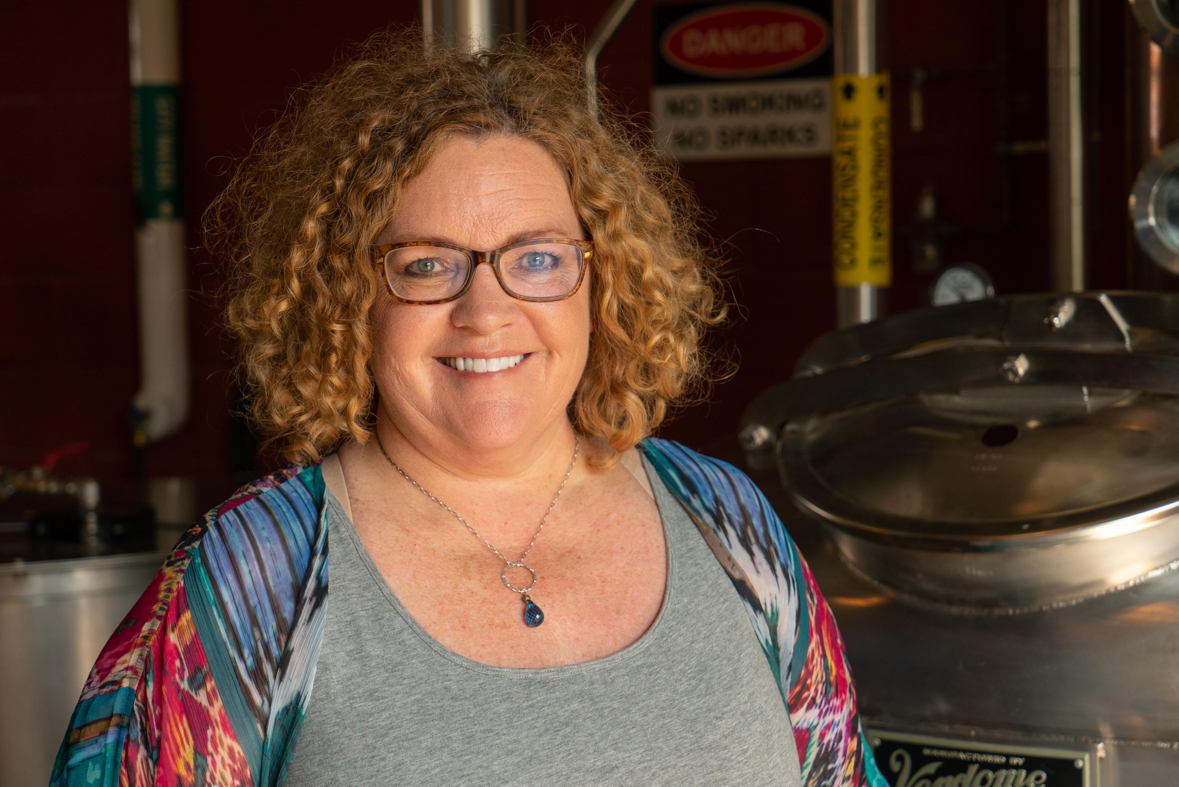 Mary Beth Williams in front of still