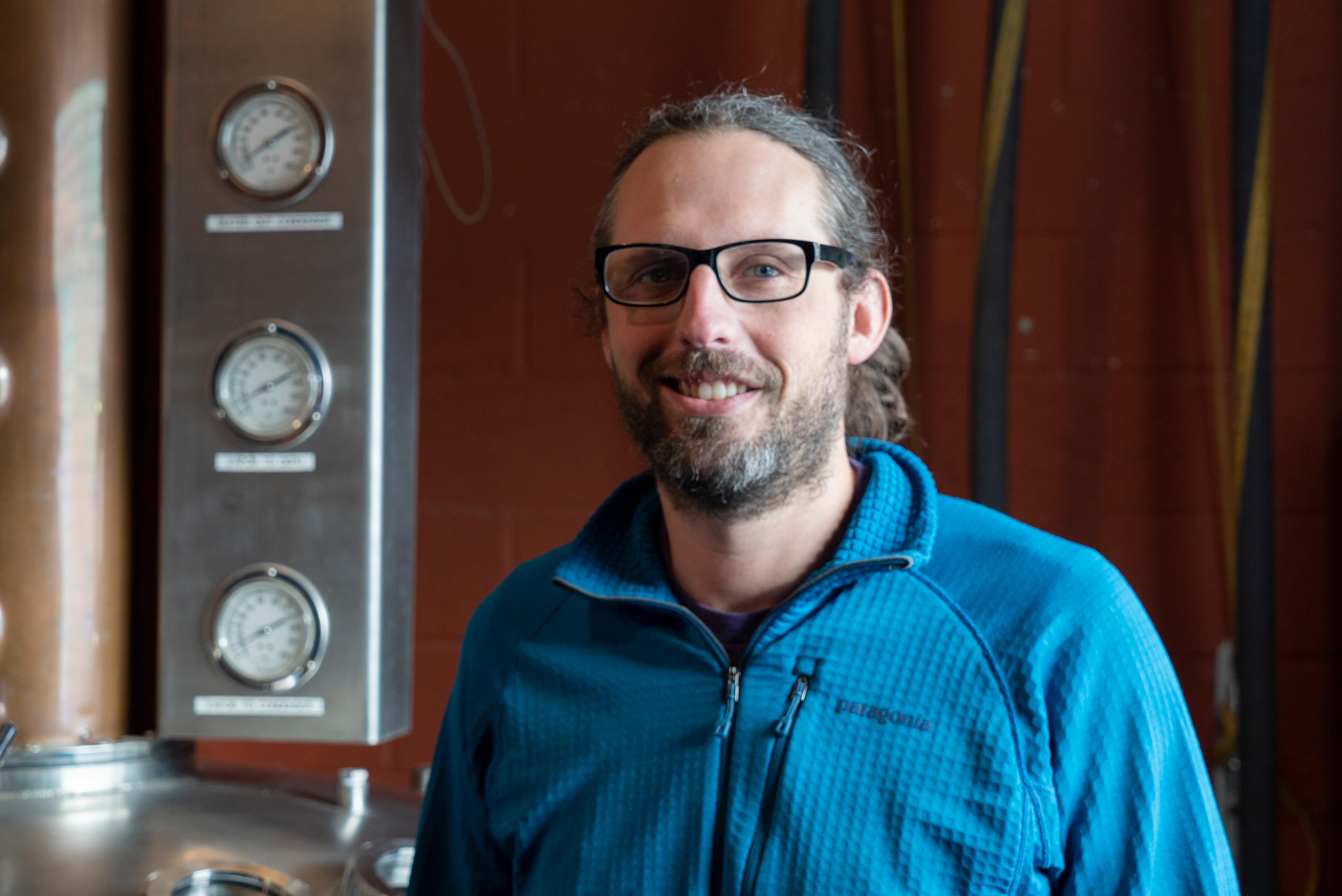 Scott Timms in front of still