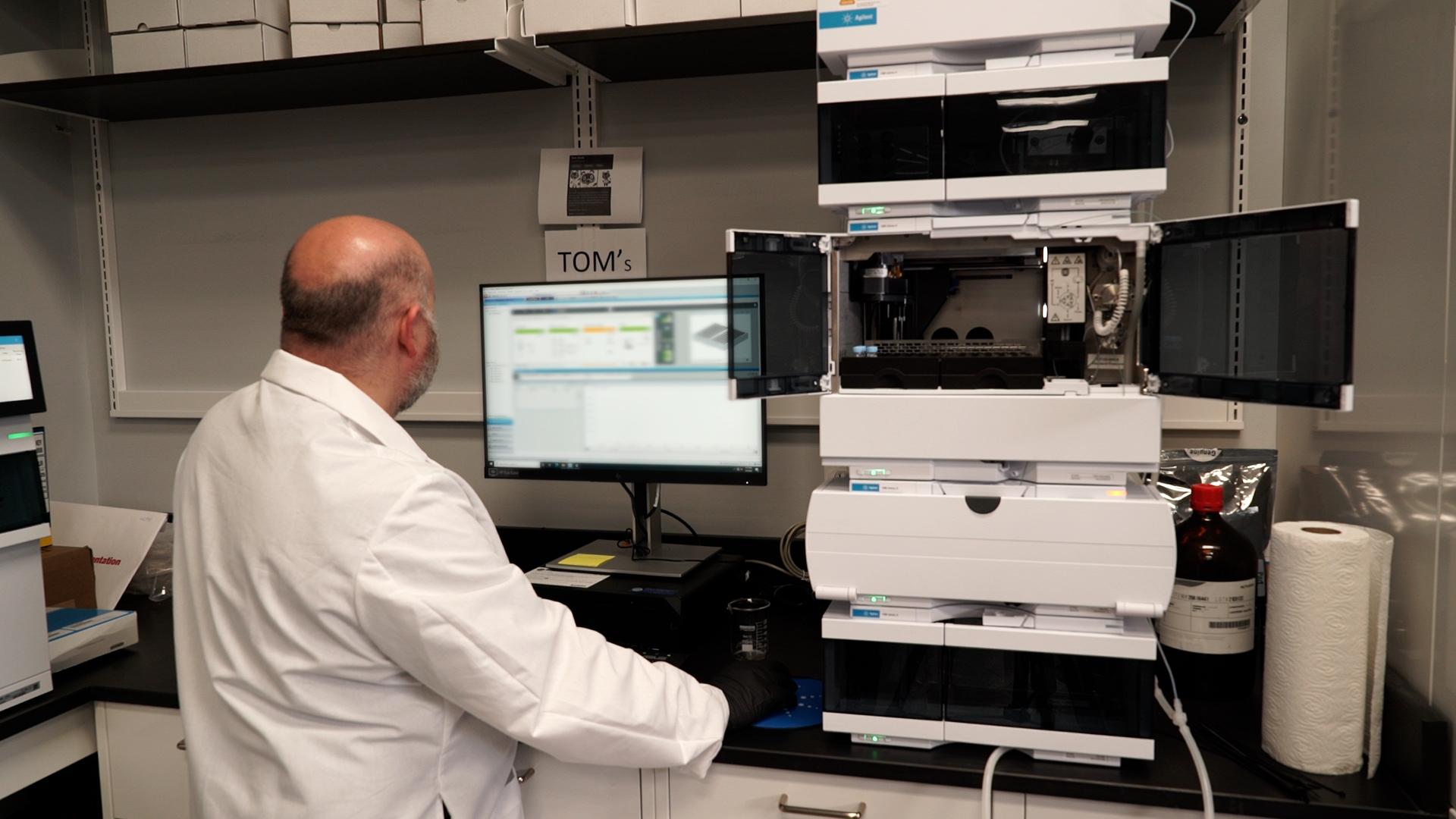 Employee using analytical machine