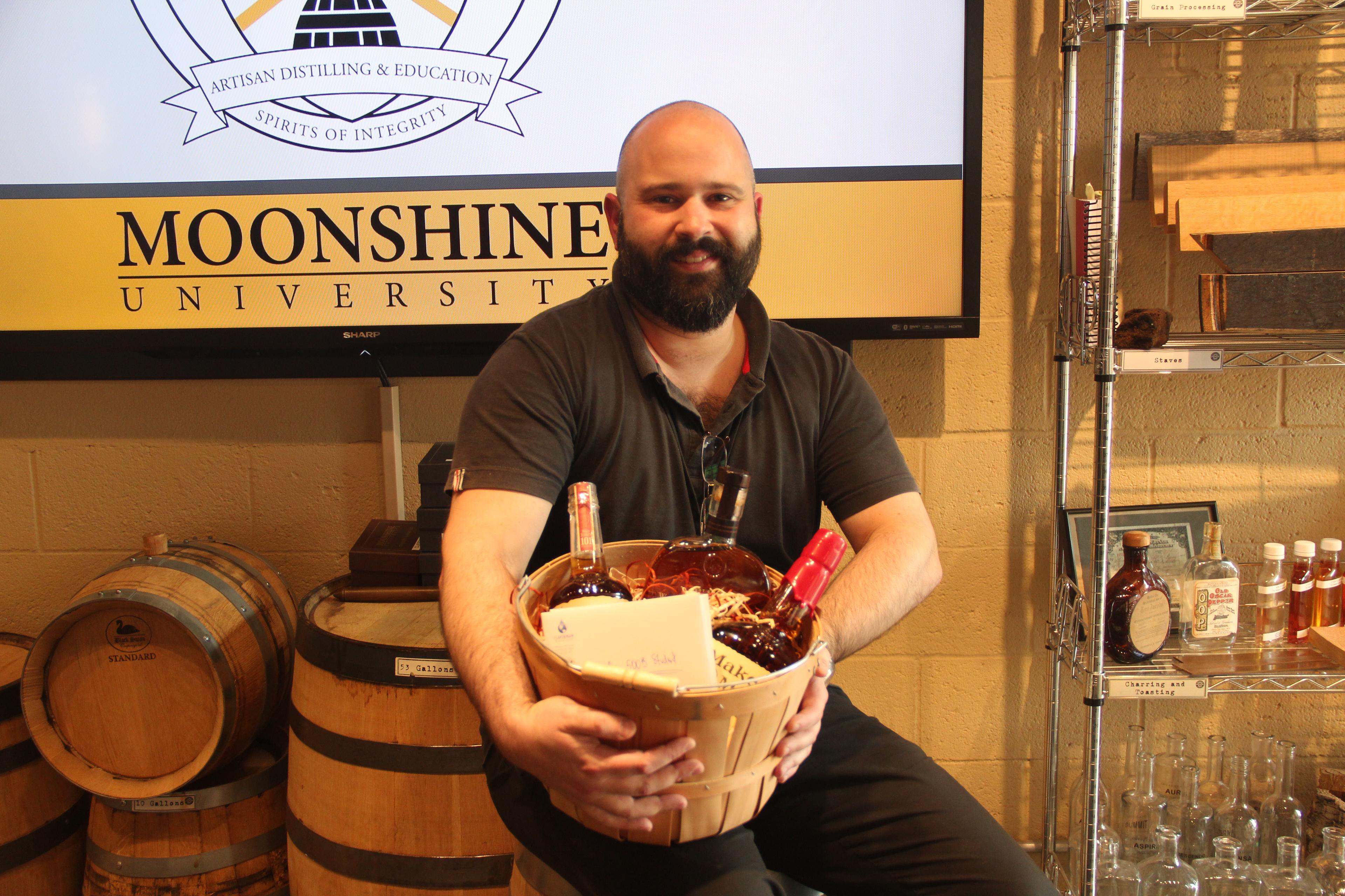 Man with bourbon bottles