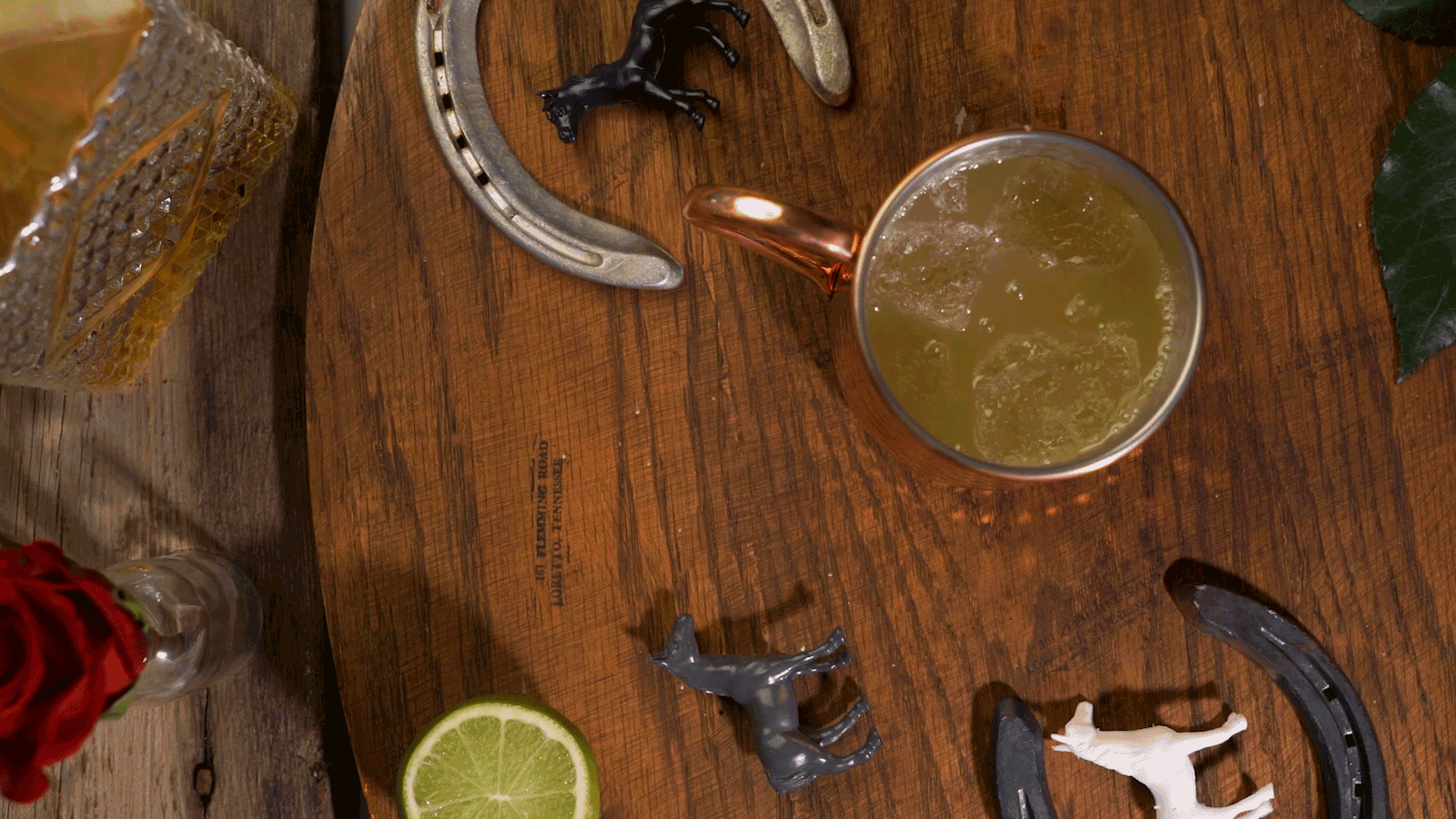Garnishing cocktail with lime wheel