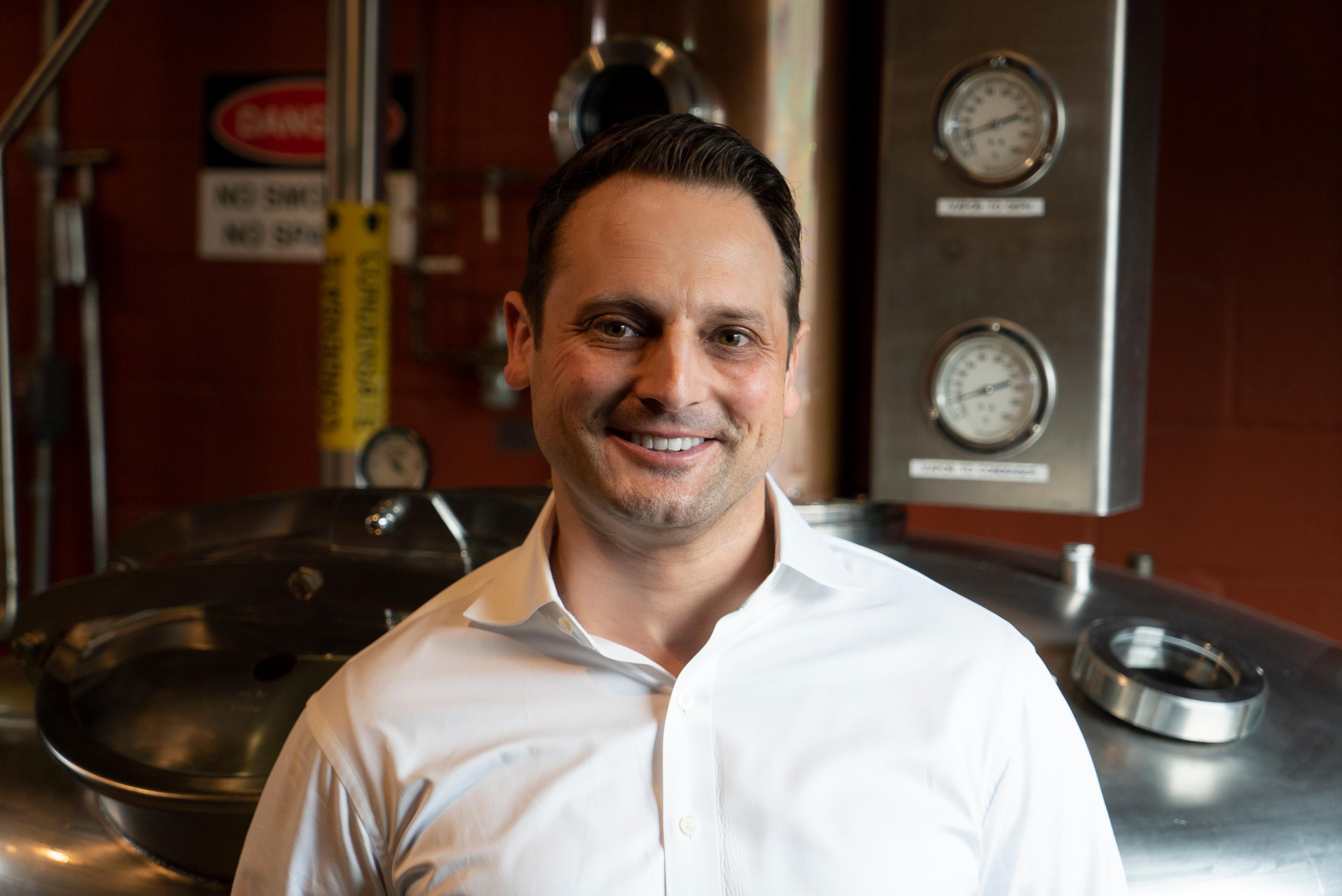 Scott Schiller in front of a still