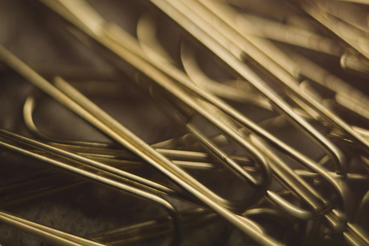 A close-up photo of gold paper clips