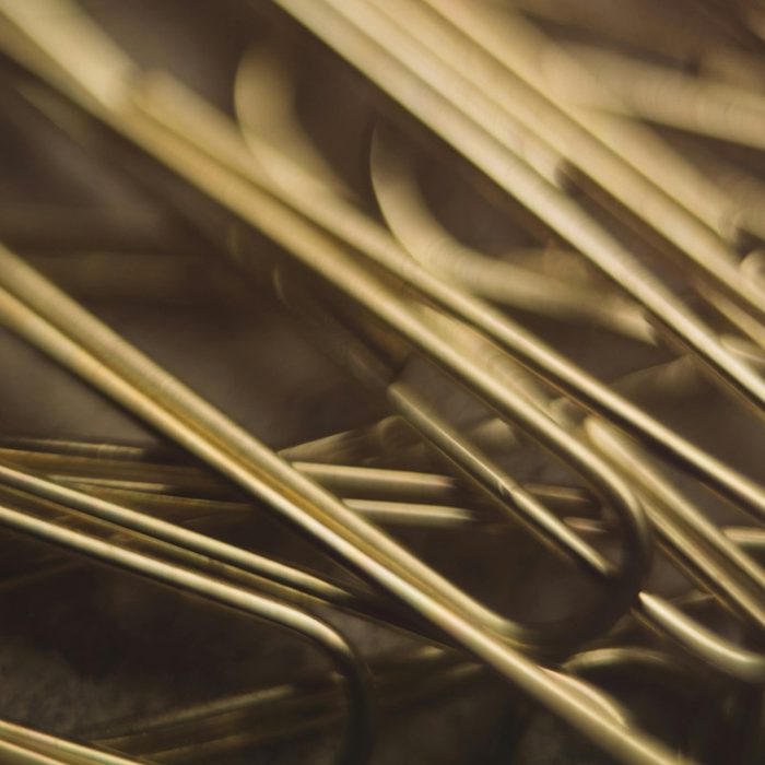 A close-up photo of gold paper clips