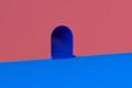 A dream-like rendering of an archway to a mysterious set of cobalt-blue stairs, leading upward.