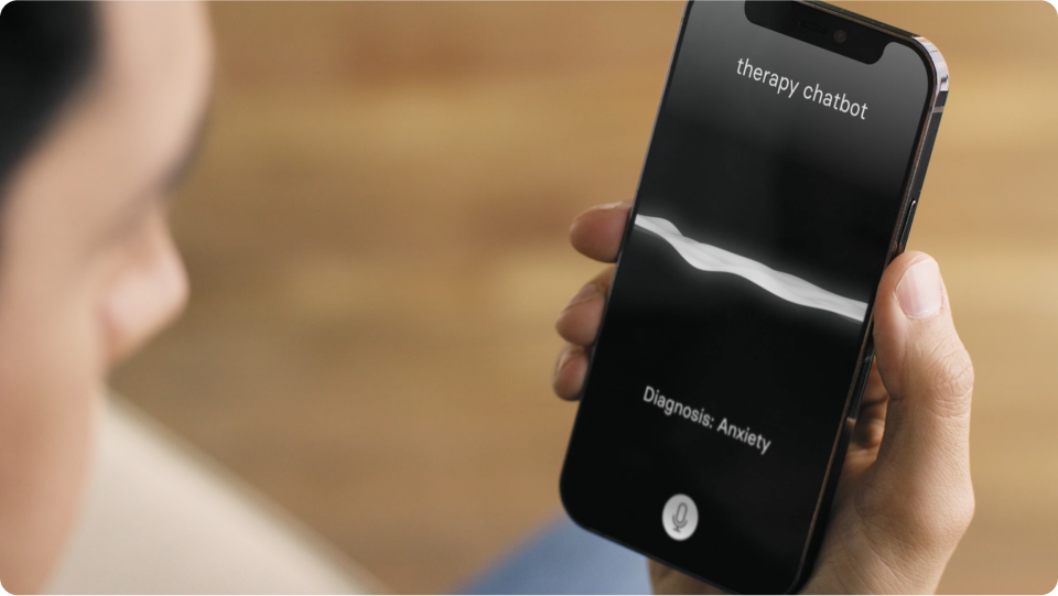 Man holding smartphone using a therapy chatbot