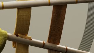 thick woven bands of shorter and longer fabric stretched between two wooden poles