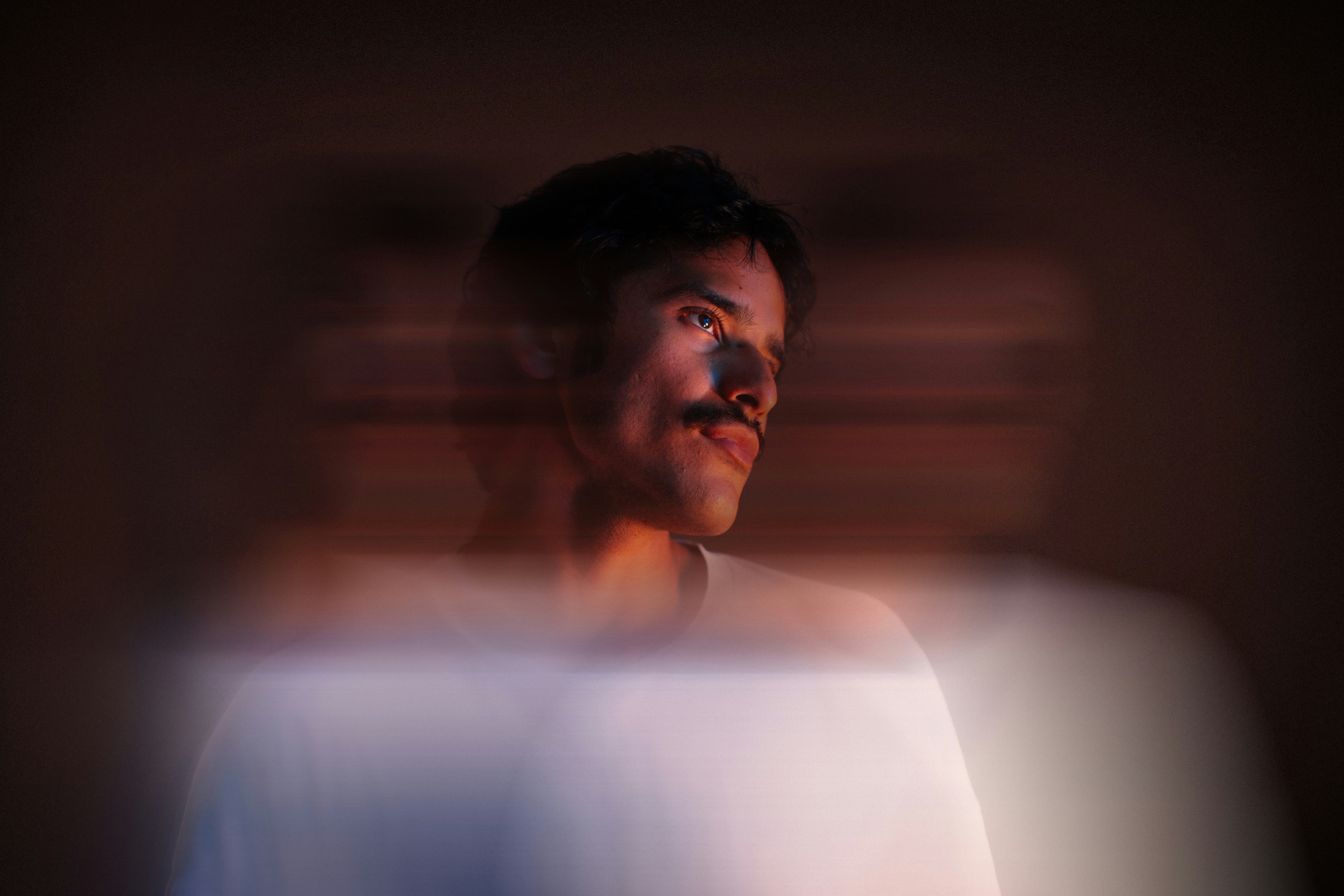 Blurred motion photo of man in white shirt