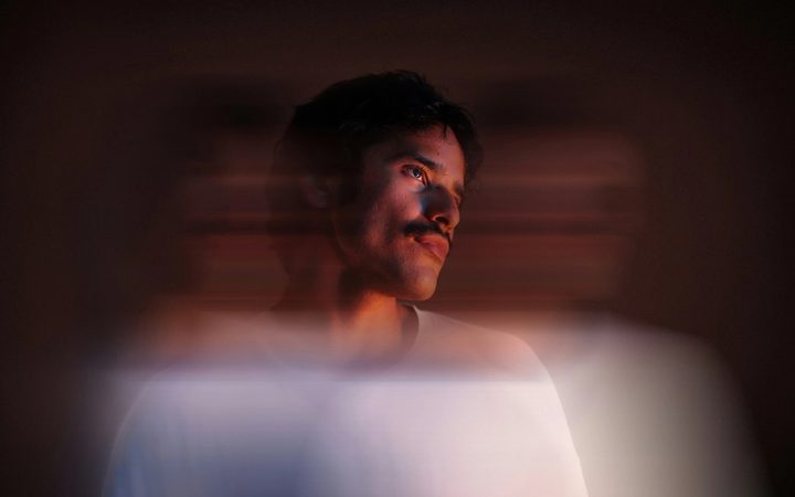 Blurred motion photo of man in white shirt