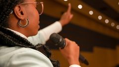 A famous black woman therapist giving a speech