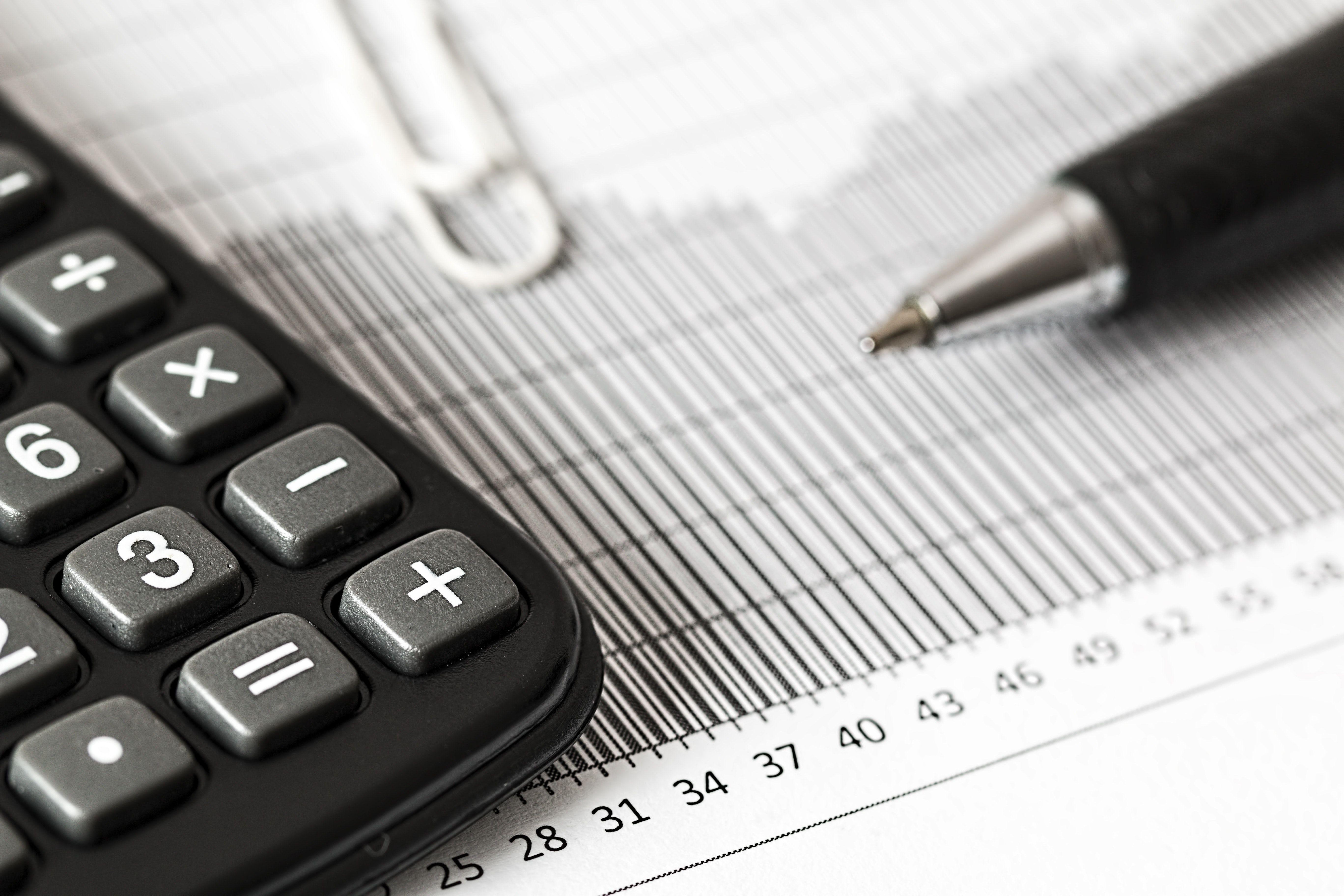 Close-up of a calculator and paper chart