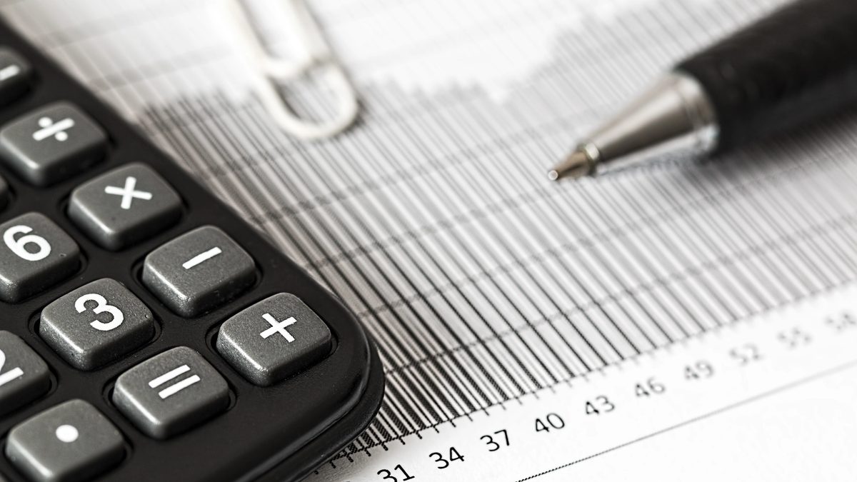 Close-up of a calculator and paper chart