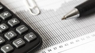 Close-up of a calculator and paper chart