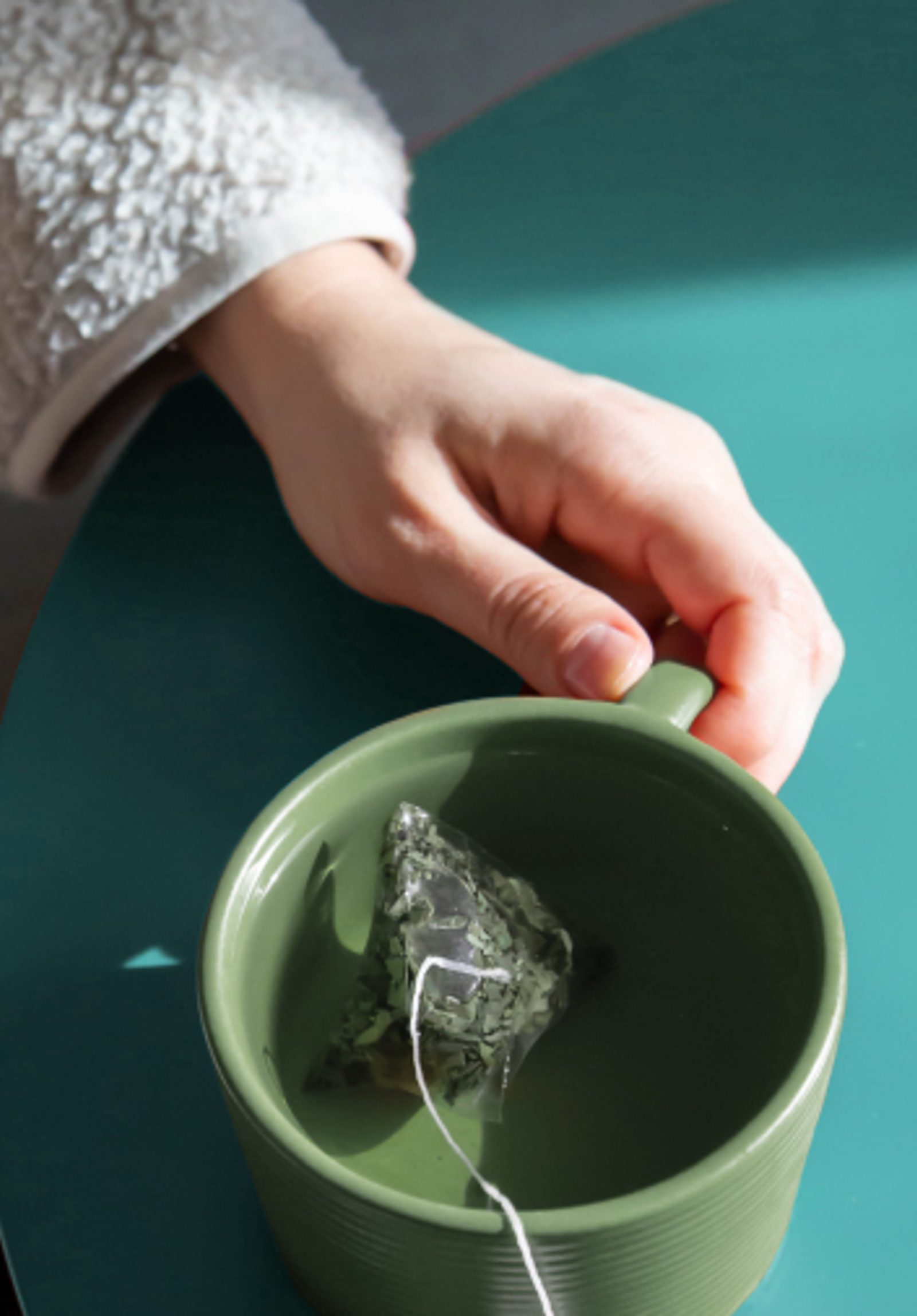 Tea mug and hand