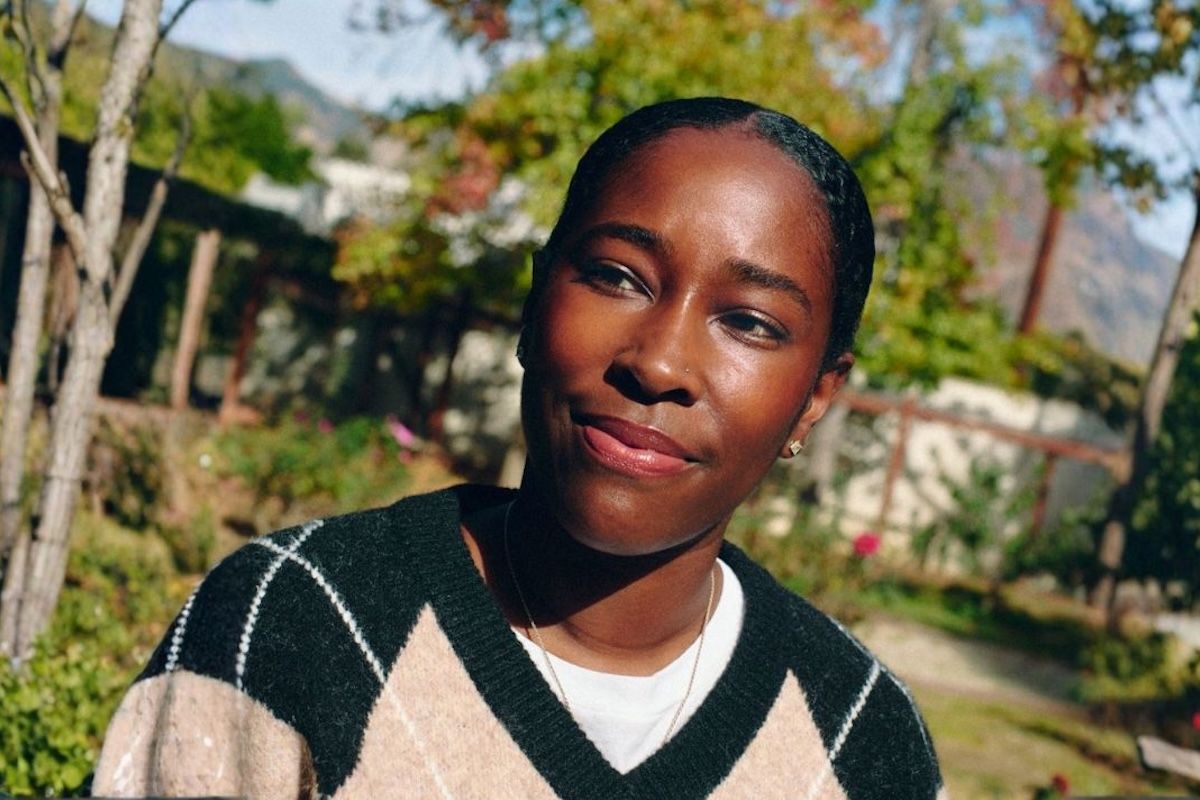 Amani Chambliss, LMFT, is shown outside in the sun, looking optimistic and determined