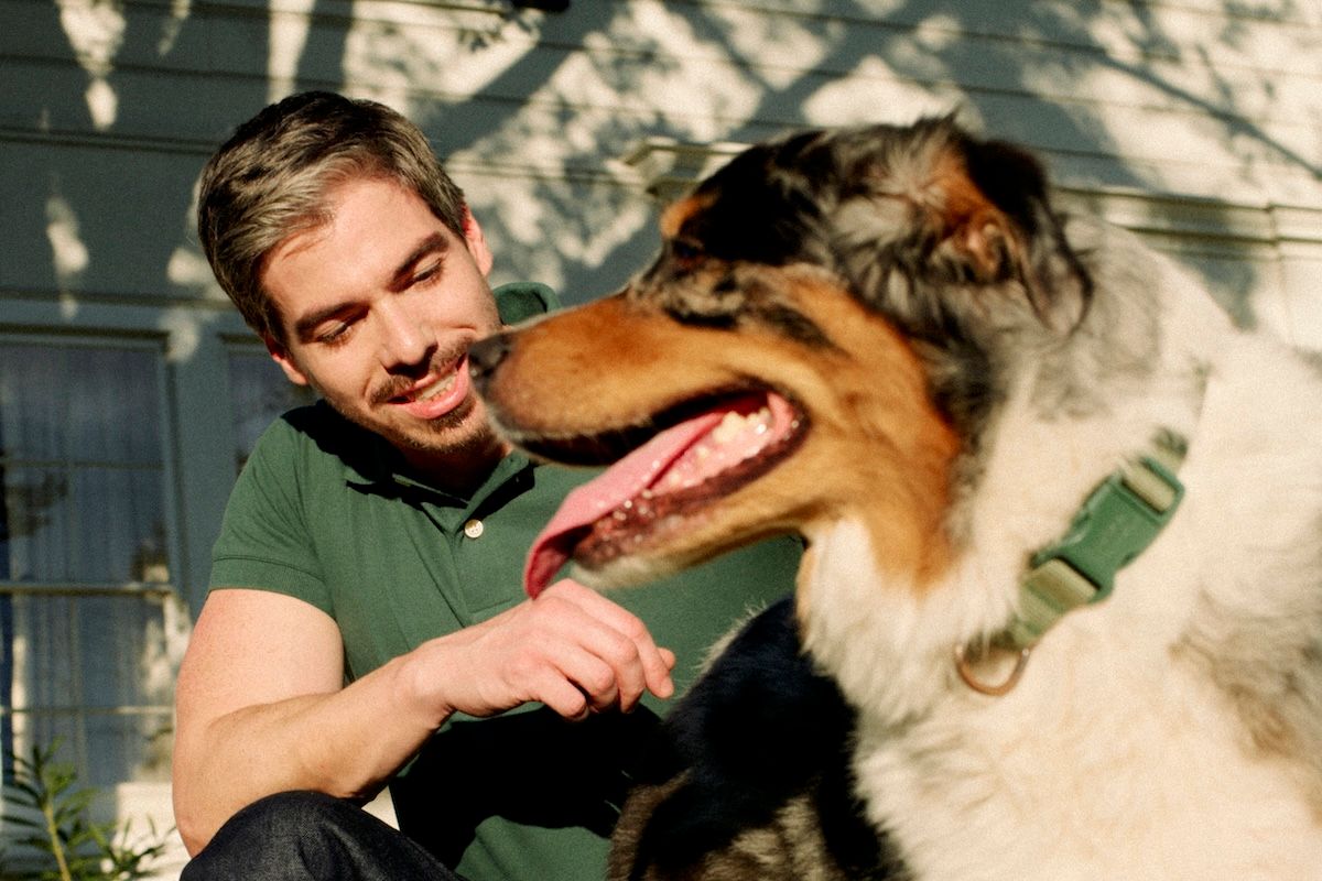 a therapist taking a break outside with his dog