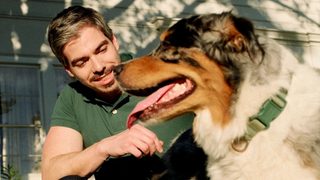 a therapist taking a break outside with his dog