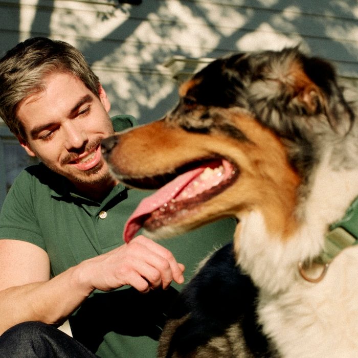 a therapist taking a break outside with his dog