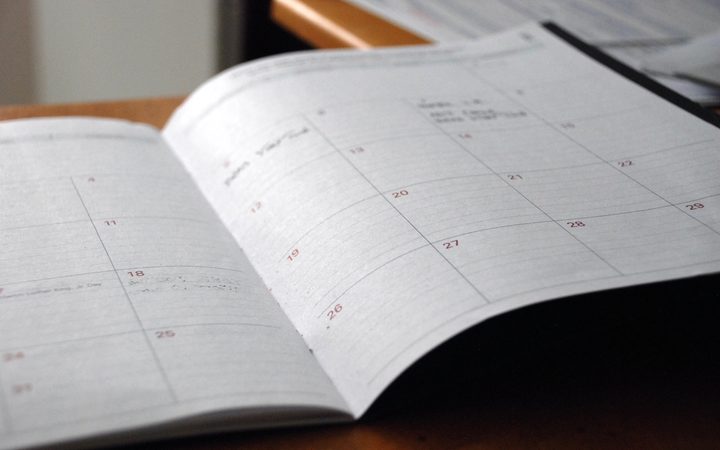 An open planner showing many blank dates without any appointments.