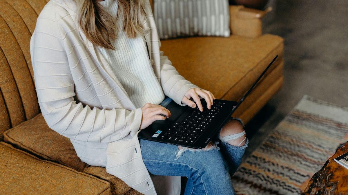 A woman on her laptop, learning about her Aetna EAP