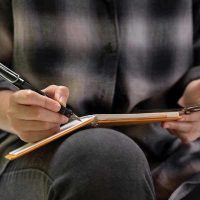 a therapist making notes to document interactive complexity after a therapy session