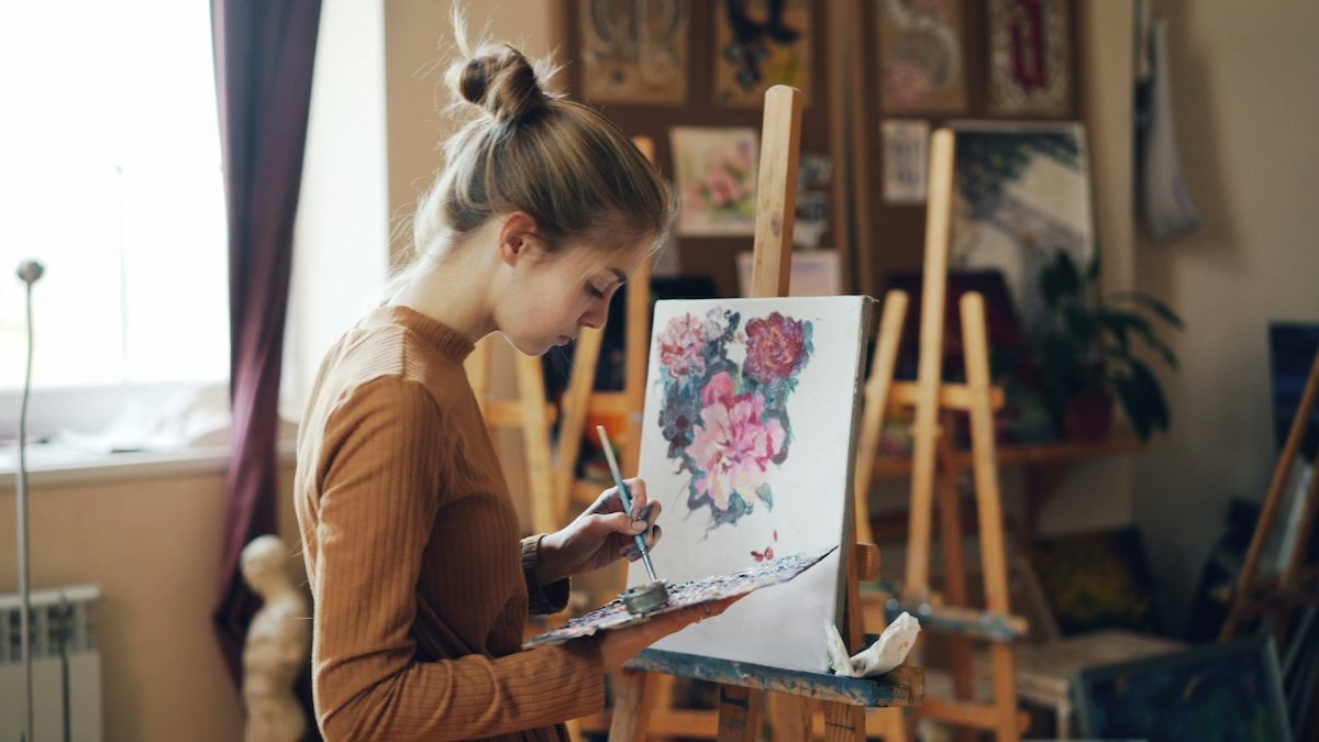 an art therapy client works on a planned activity during an online session