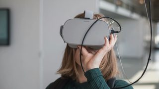 Person wearing a VR headset indoors