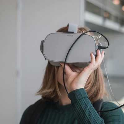 Person wearing a VR headset indoors