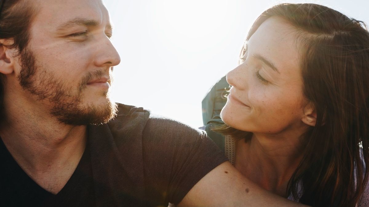 a man and woman look at each other with deep empathy 