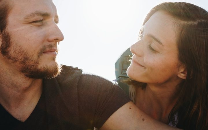 a man and woman look at each other with deep empathy