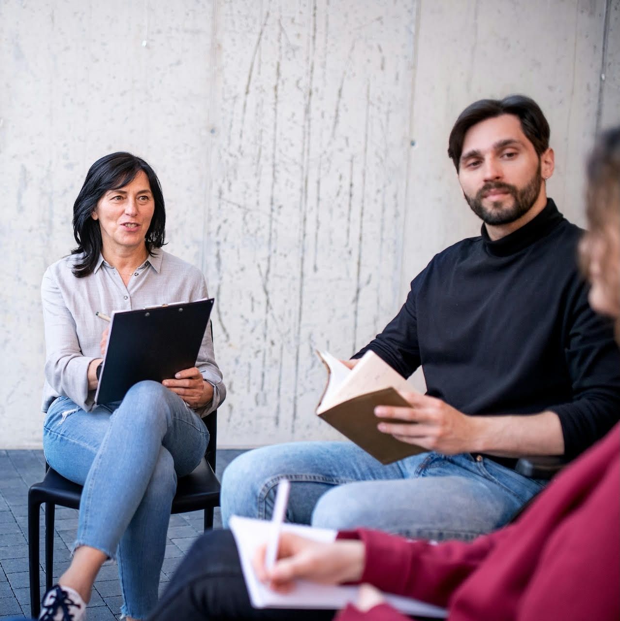 Therapy provider using AI tools on a laptop