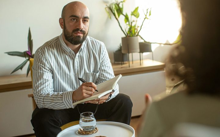 A sex and porn addiction therapist answering questions during a session