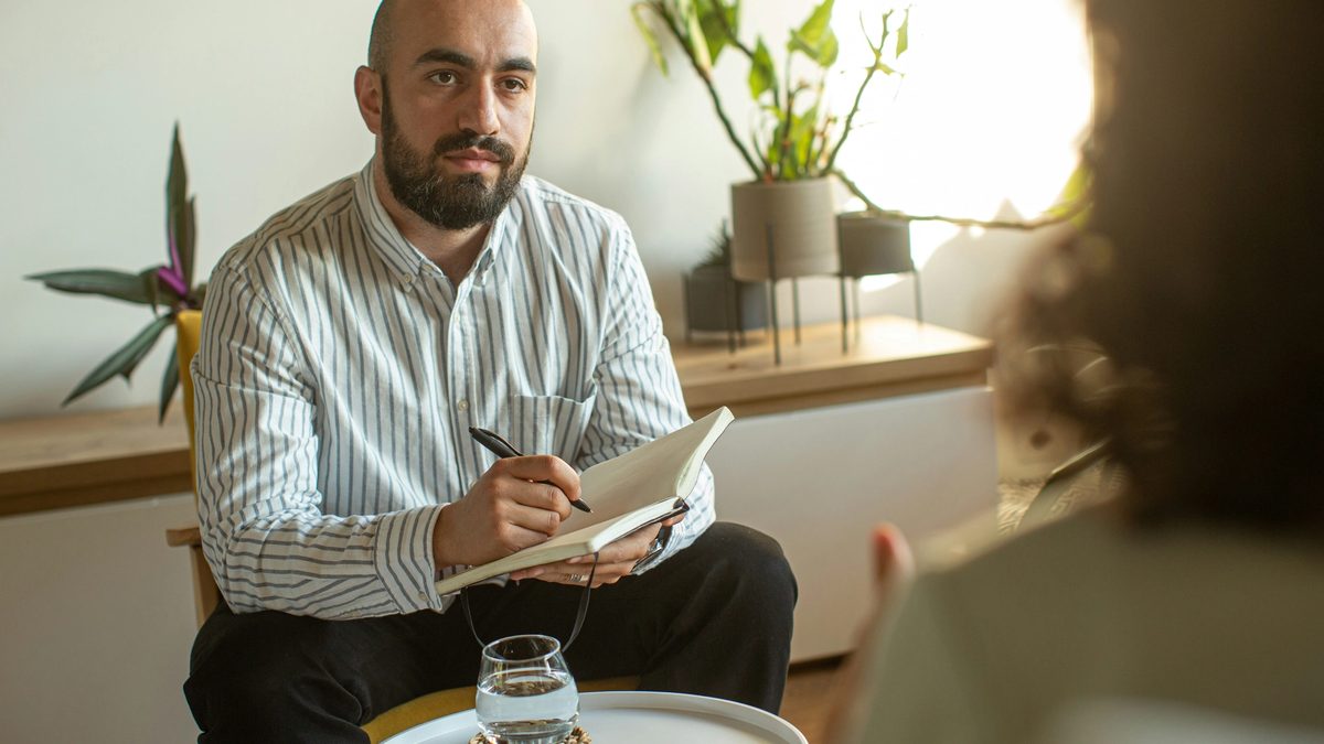 A sex and porn addiction therapist answering questions during a session
