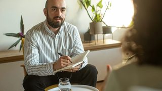 A sex and porn addiction therapist answering questions during a session