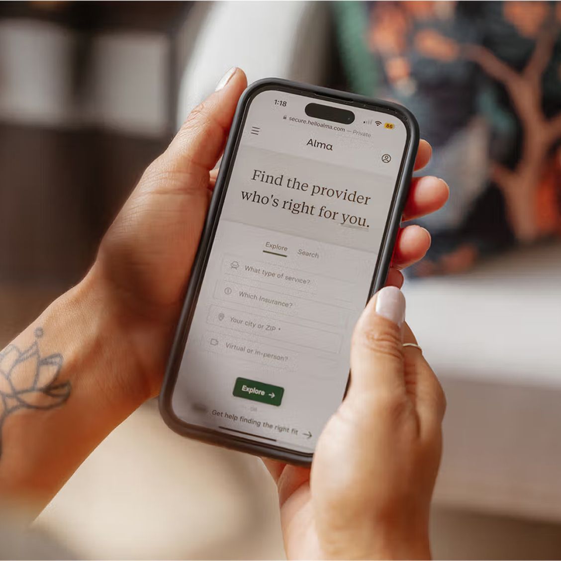 A person using their phone to search for an Alma therapist