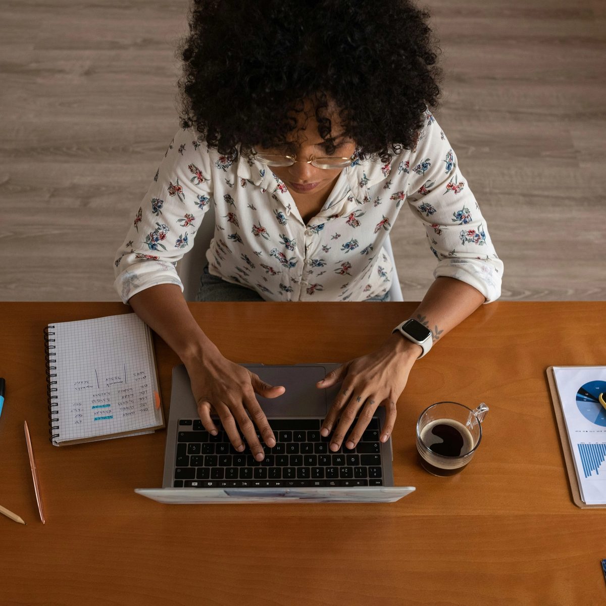 Woman working on her laptop in her office