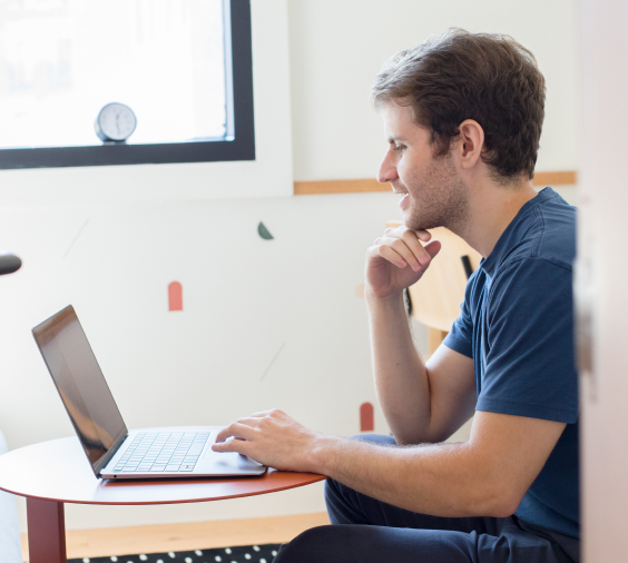 online therapist conducting a session on laptop