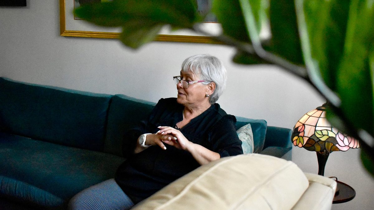A behind-the-scenes image of a therapist featured in Alma's new campaign, resting on a couch in her office.