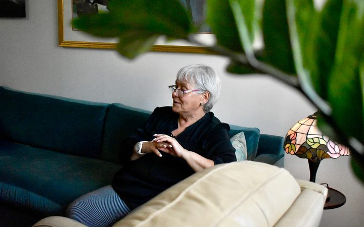 A behind-the-scenes image of a therapist featured in Alma's new campaign, resting on a couch in her office.