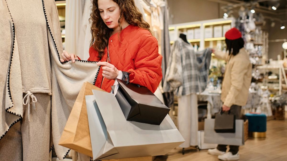 A woman out shopping for the holidays, worried about the cost of gifts.
