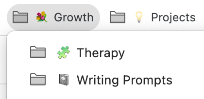 A screenshot of a bookmark folder labelled with a flower emoji and the word "Growth." Under that tab are two additional folders, with one labelled "Therapy" with a puzzle piece symbol, and another labelled "Writing Prompts" with a notebook emoji.