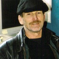 An image of Pete Walker, C-PTSD expert, smiling in his office.