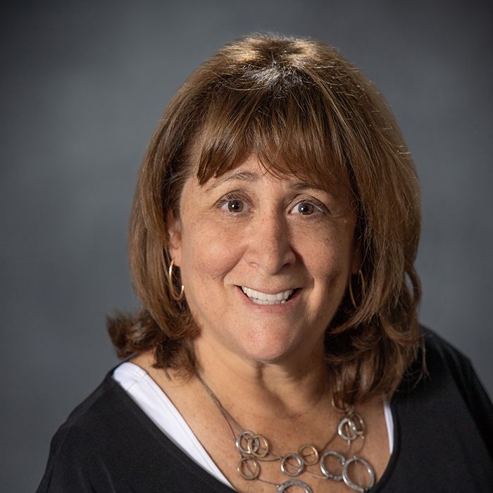 Marla Fogelman smiles in a corporate headshot.