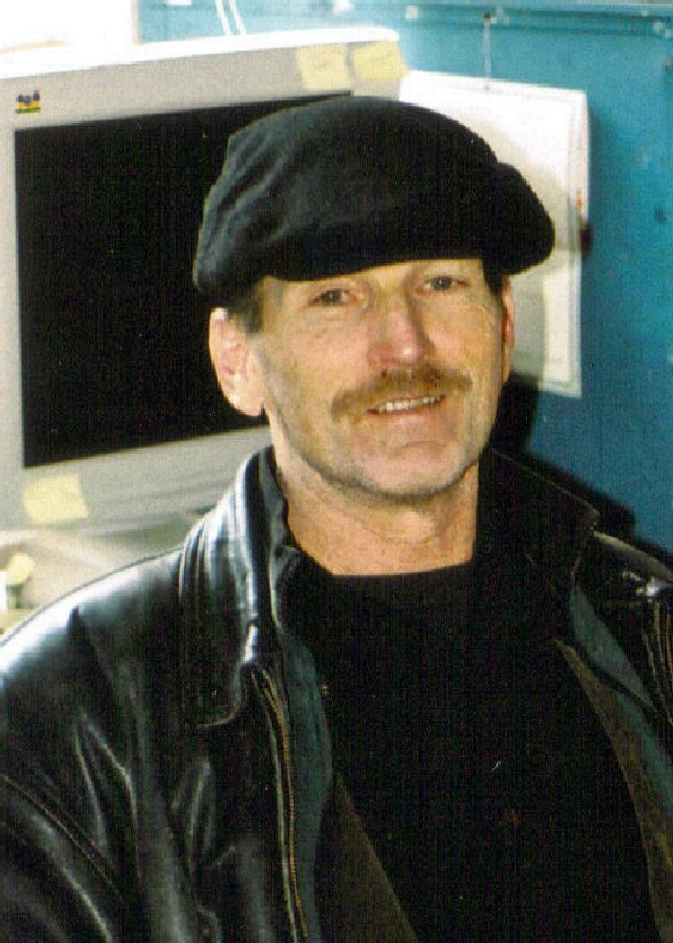 An image of Pete Walker, C-PTSD expert, smiling in his office.