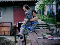 From the series "Left Bank". Katrine with her mother Angela at their courtyard. Ribnita, Transnistrian Region, Republic of Moldova. | DER GREIF