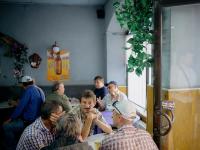 Men having a drink during the general local elections. Chisinau, Republic of Moldova. | DER GREIF