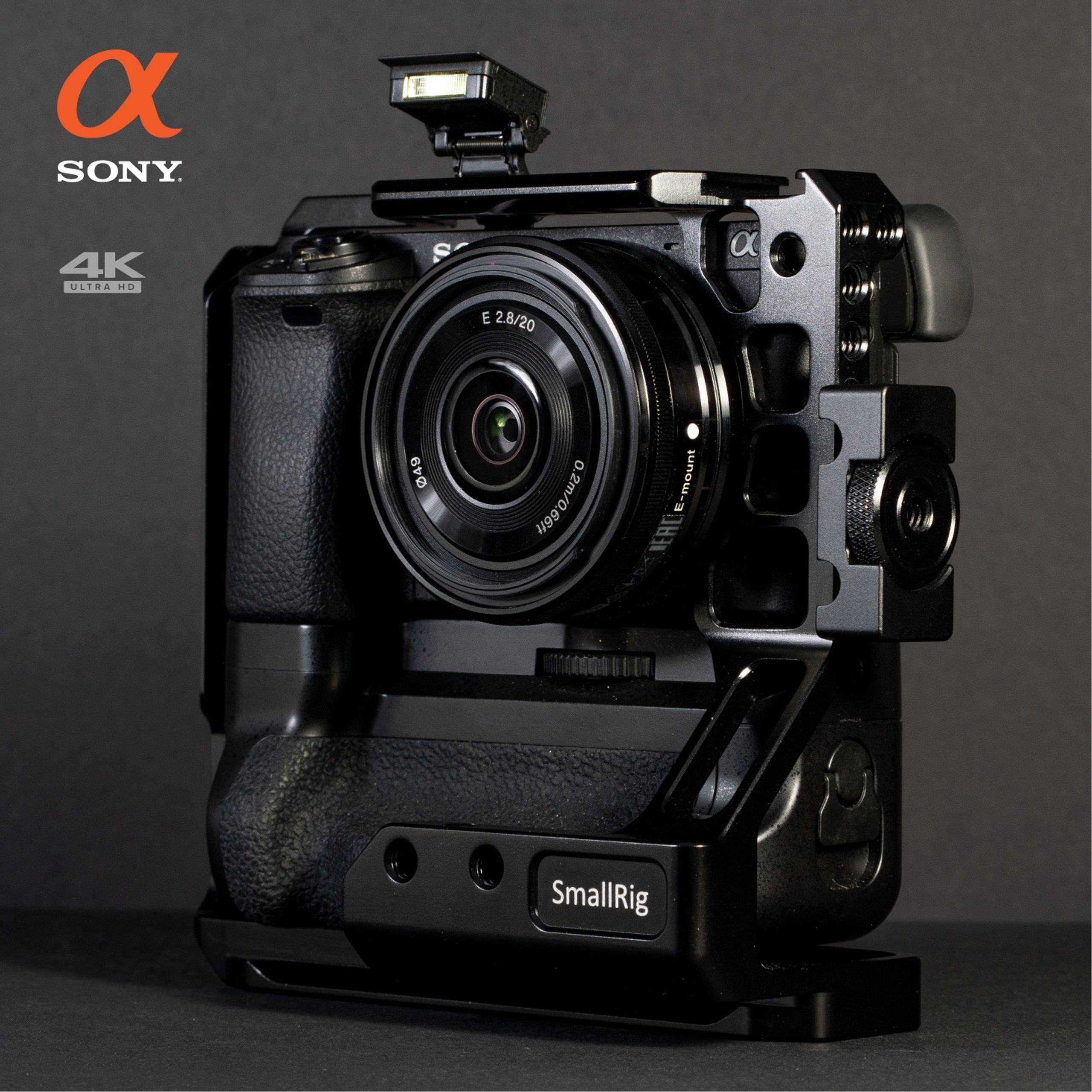 Sony a6300 in a SmallRig cage with battery grip and a 20mm lens, labelled for a 4K listing