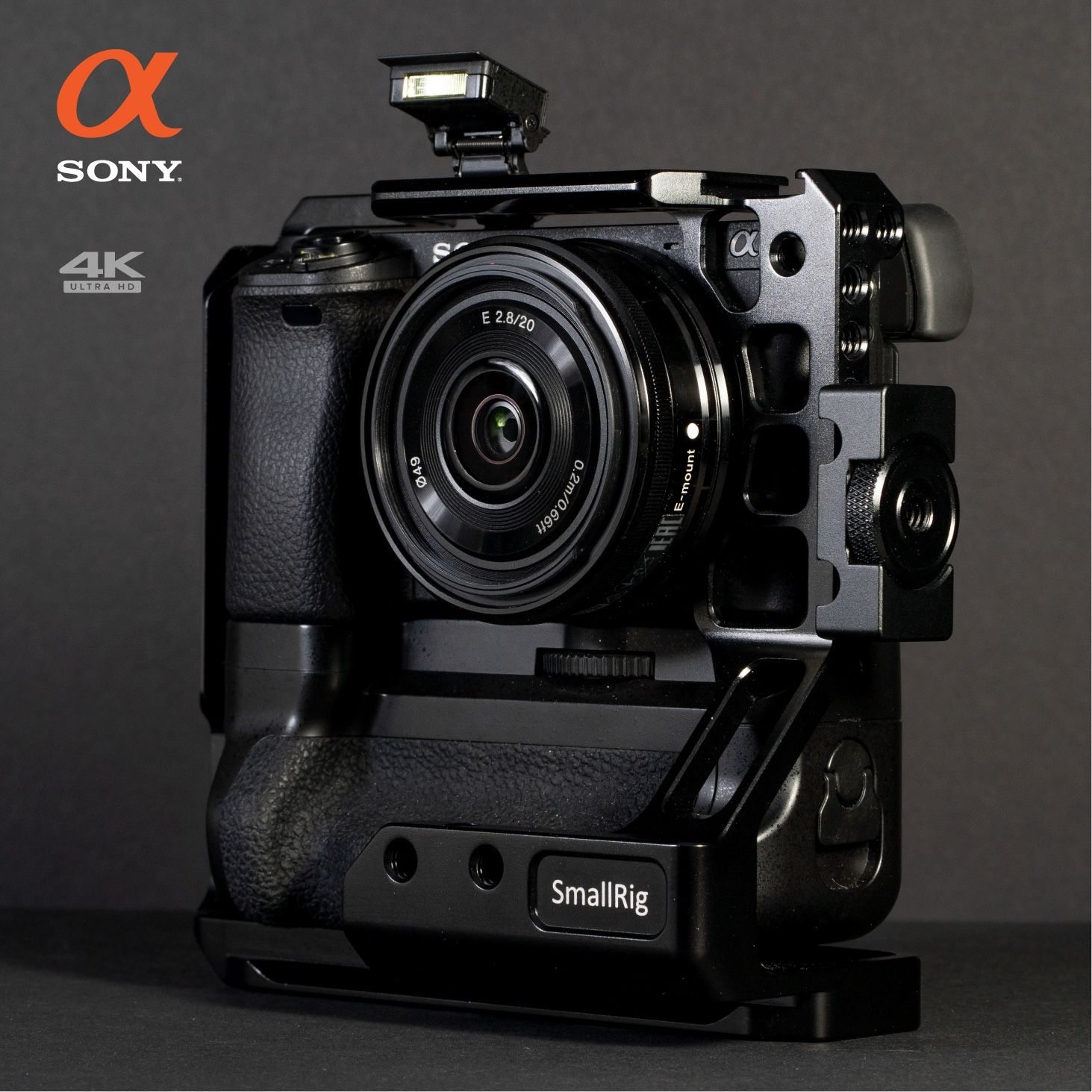 Sony a6300 in a SmallRig cage with battery grip and a 20mm lens, labelled for a 4K listing